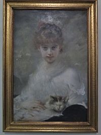 Mladá dívka s kočkou od francouzského malíře Charlese Joshuy Chaplina