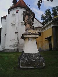 14. Barokní socha sv. Jana Nepomuckého stojící na architektonizovaném soklu je datována do roku 1749.