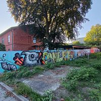 Mural na plotu firmy OWLET STAV