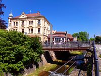 Náměstí K. V. Raise čp. 163 a Lázeňská čp. 551 (Lázně Bělohrad)