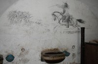 Obrázek na zdi koňského ustájení