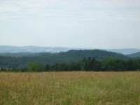 Pohled nad prameny Dřevnice na Vizovické vrchy (vpravo vysílač nad Zlínem)